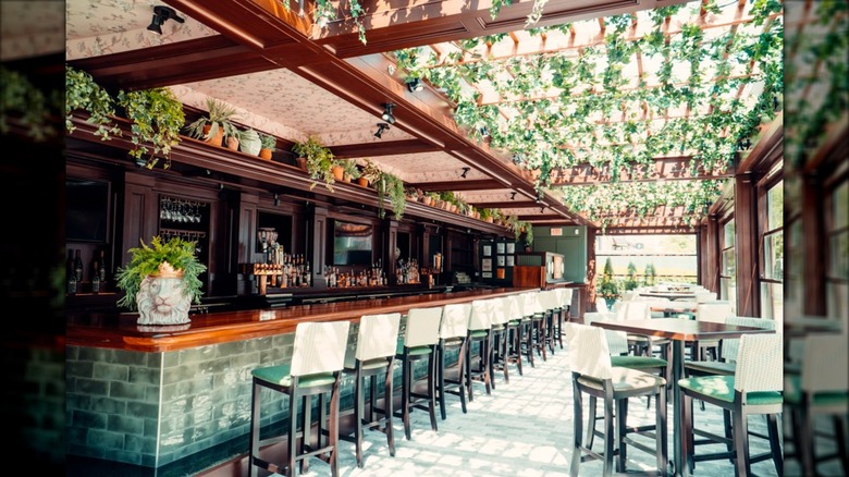 Joe's on Newbury dining patio and bar with empty seats and tables