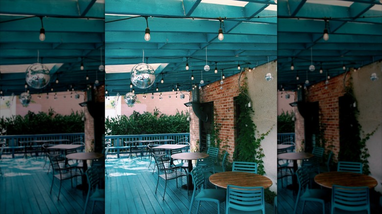 The Old Post dining patio with hanging mini disco ball decor