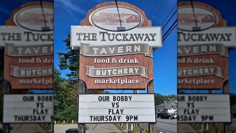 Tuckaway Tavern & Butchery roadside sign on sunny day