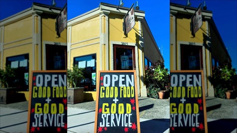Circa Grill and Alehouse exterior with clapboard sign in front on sidewalk