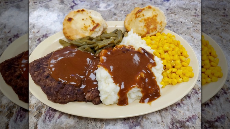 Dolly's Diner meatloaf with gravy, mashed potatoes, and sweetcorn