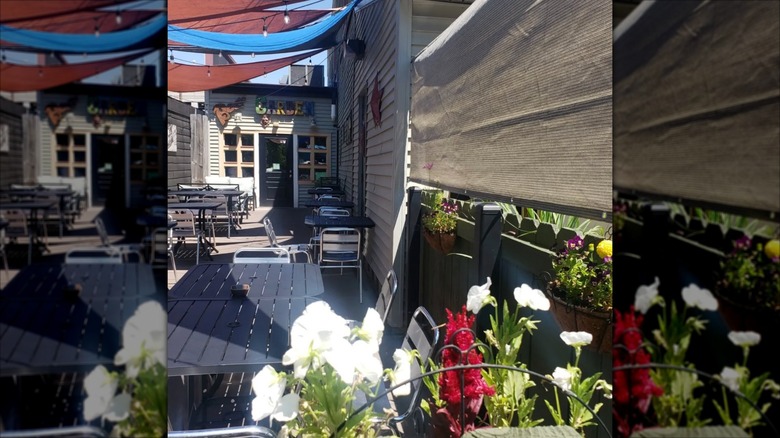 McBob's Pub & Grill Dining Patio on sunny day with flowers in foreground