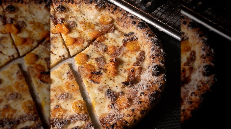 White pizza with yellow tomatoes