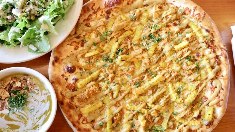 Pizza topped with fries