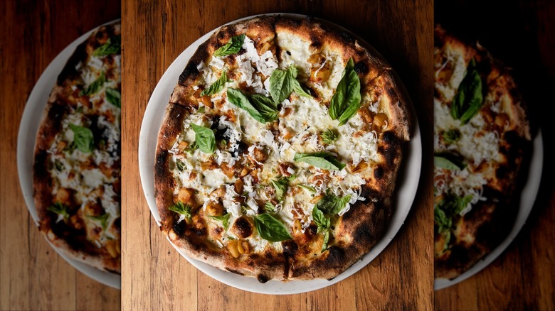 White sauce pizza on wooden table