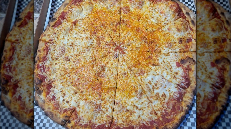 Large cheese pizza cut into slices