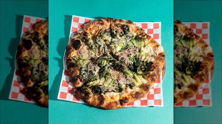 White sauce pizza topped with broccoli