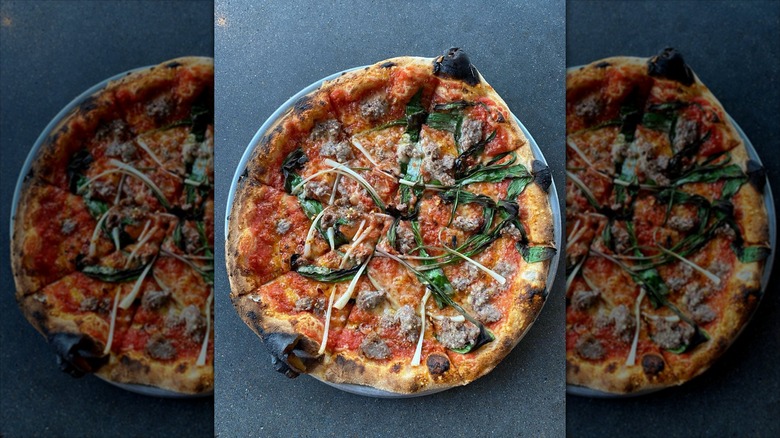 Wood fired pizza on black table