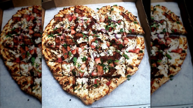 Heart-shaped pizza in wooden box