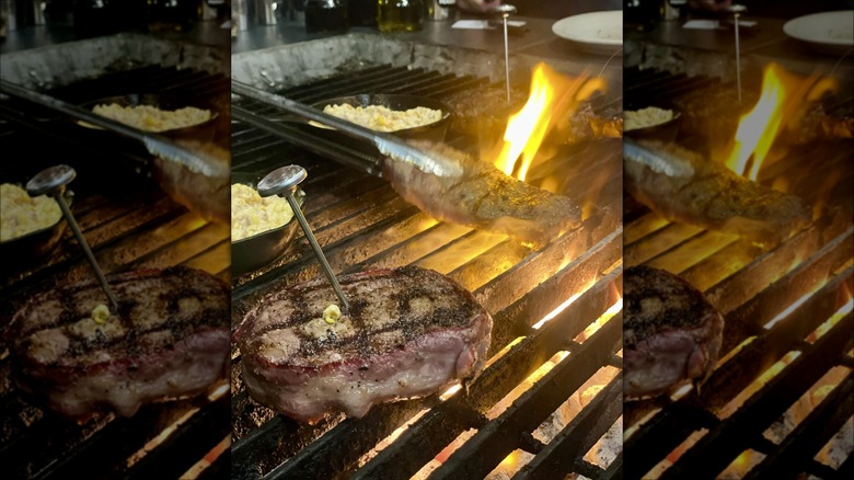 Rube's Steakhouse Waukee filet mignon grilling on an open grill
