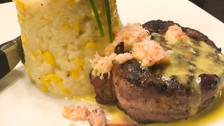 Jake's Downtown 8 oz. Bacon wrapped filet with a corn risotto topped with crab and a garlic hollandaise