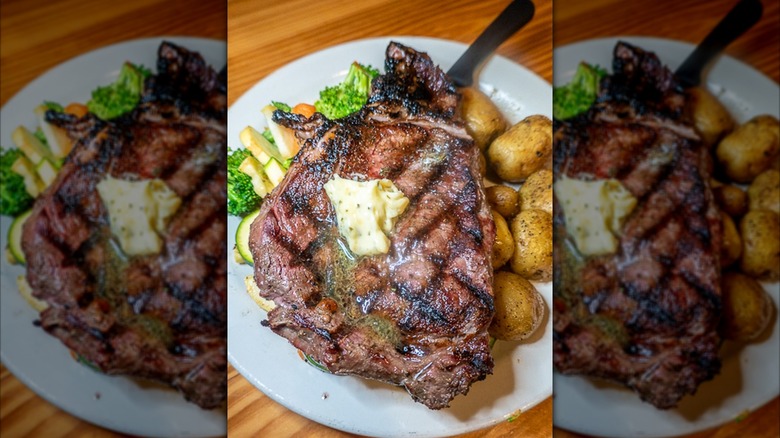 Steak with butter and small potatoes at Big Mike's Steakhouse