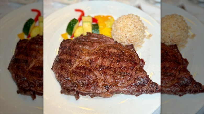 Steak on plate with rice at Hy's Steak House