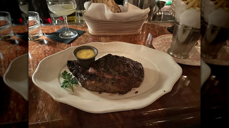 Steak on plate at Bavette's Bar and Boeuf