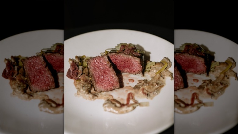 Rare steak cut open at St. Elmo Steak House