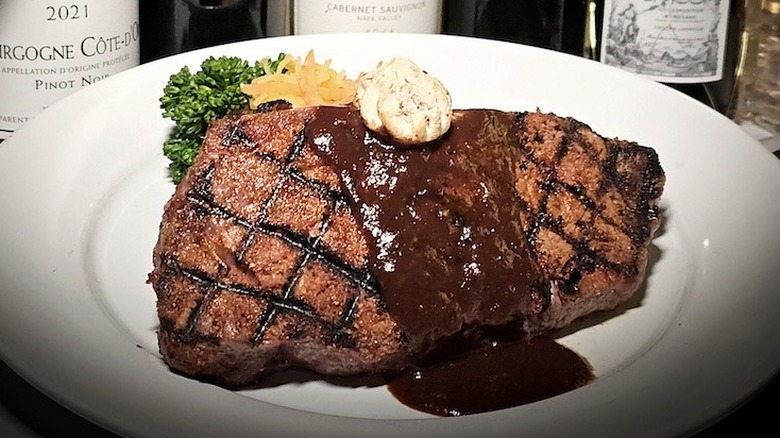 sauced steak on a plate at The Continental Divide