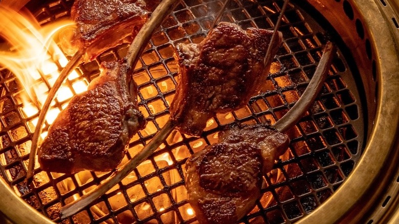 steaks on a grill at Cote Korean Steakhouse