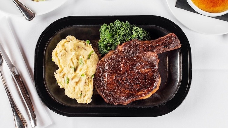 steak and mashed potatoes on plate at The RingSide