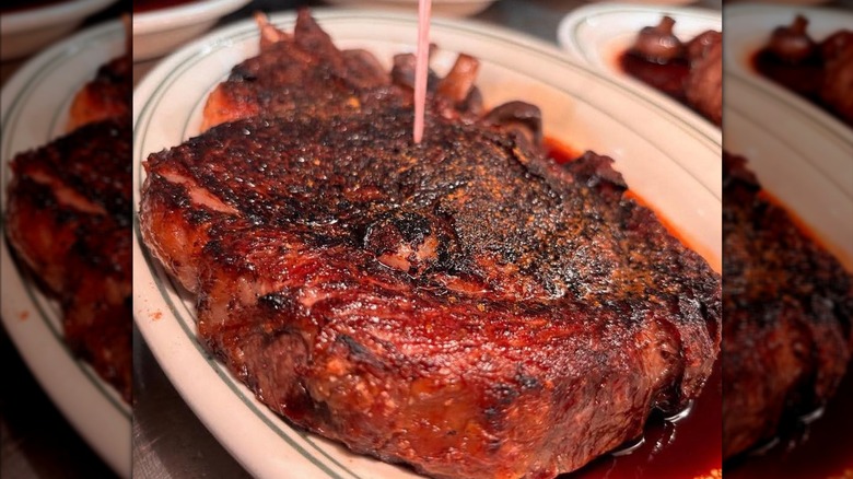steak on plate at Five O'Clock Steakhouse