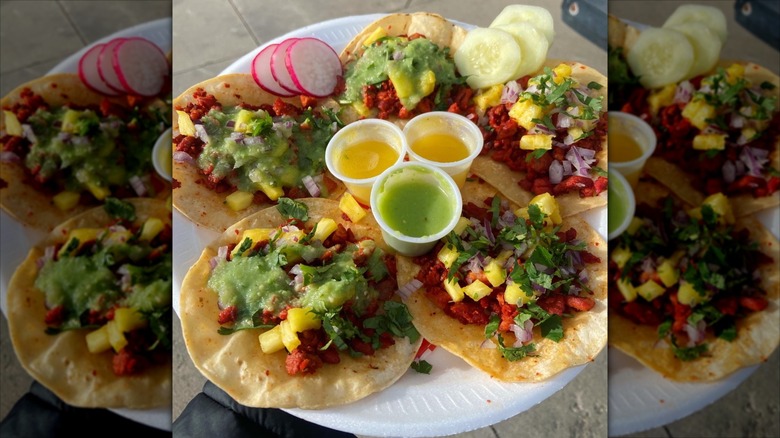 A variety of tacos with poblano peppers and sauces