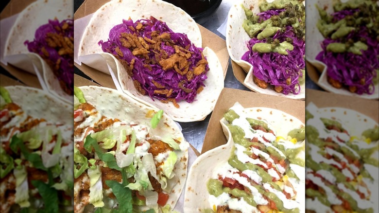 Four large flour tacos with different toppings and salsas