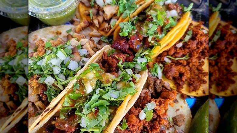 A close up of a tacos with toppings