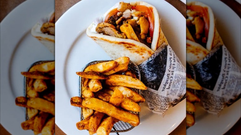 Gyro with side of French fries from YiaYia's Greek Kitchen on a white plate