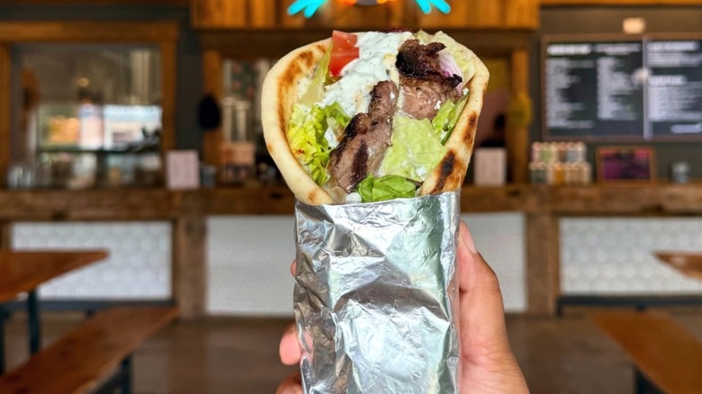 Gyro being held by a hand from Magissa