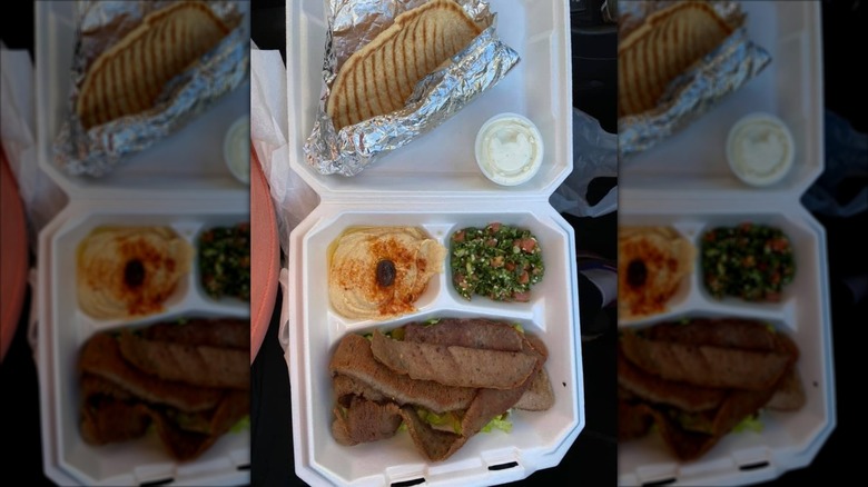 Gyro Platter from Gyro Time Restaurant with tabbouli and hummus in a styrofoam to-go container