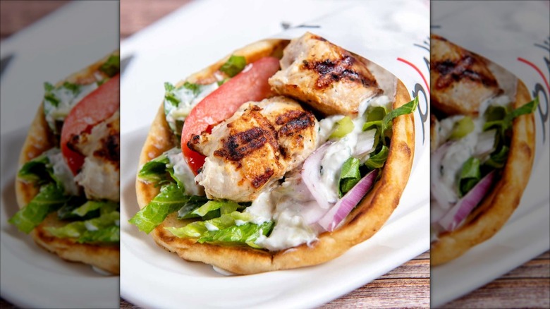 Chicken Souvlaki Gyro Wrap from Plaka Grill on a white platter
