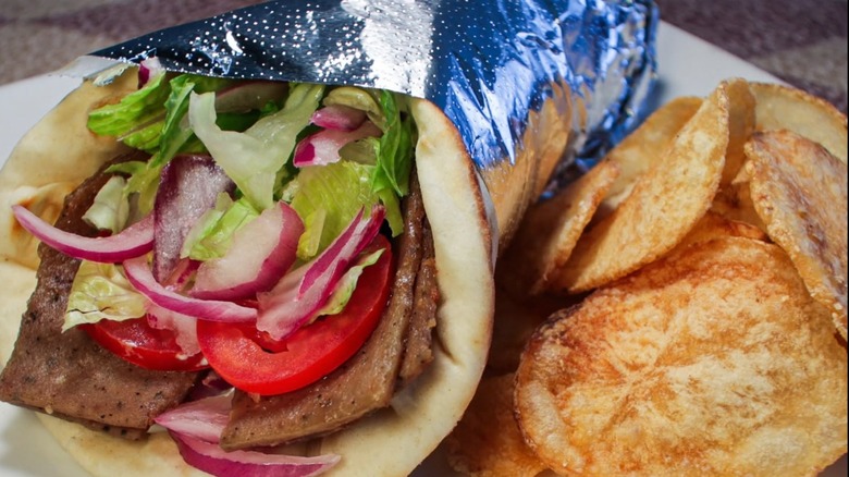 Gyro from Sokolata with fries on a white plate