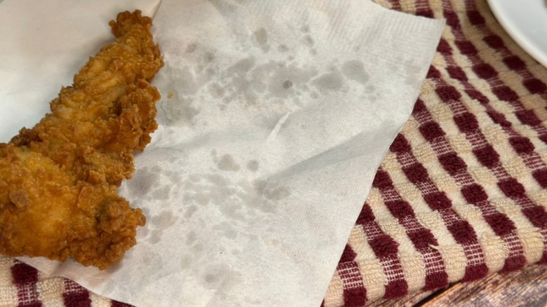 Chick-fil-A tender on napkin with greasy residue