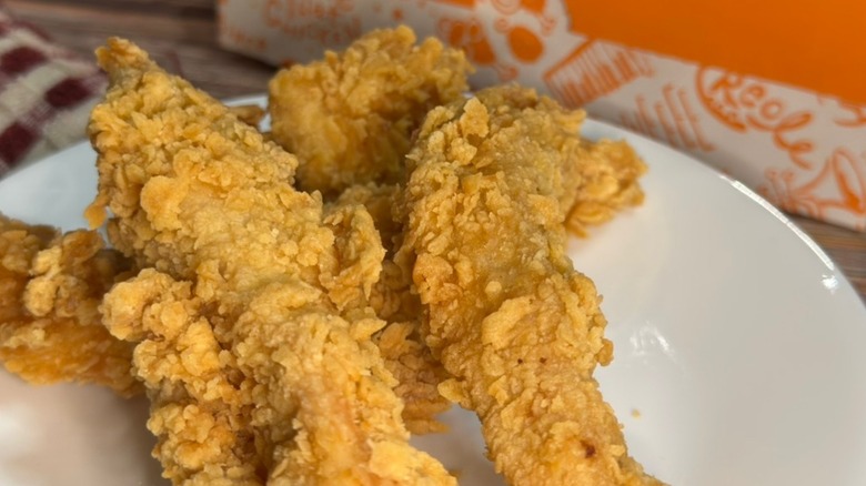Popeyes chicken on a white plate