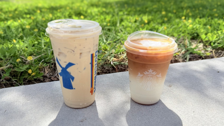 Both Golden Eagle and Caramel Macchiato drinks from Dutch Bros and Starbucks in plastic to-go cups