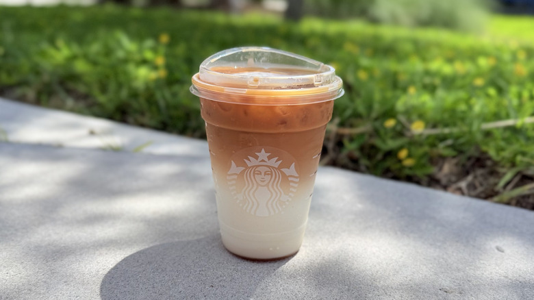 Starbucks Iced Caramel Macchiato in a plastic to-go cup