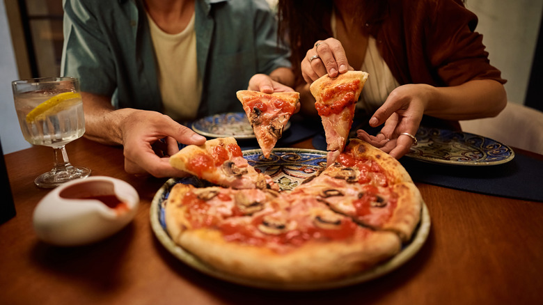 Couple sharing pizza