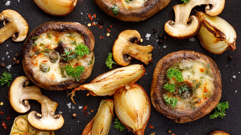 Roasted stuffed mushrooms and garlic heads