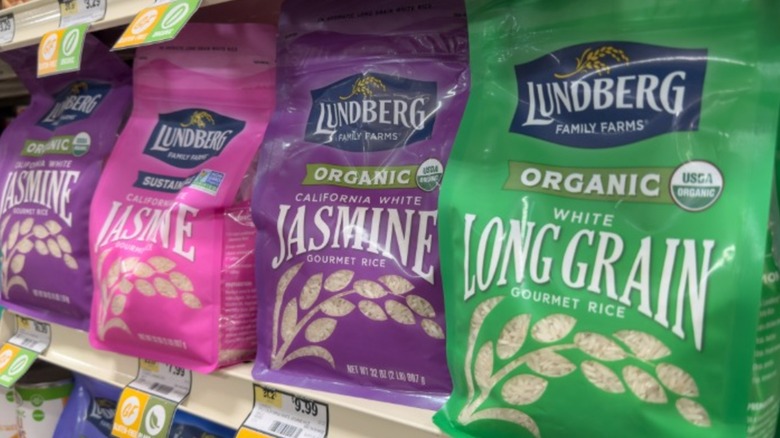 Bags of Lundberg Family Farms jasmine and long grain rice on supermarket shelf