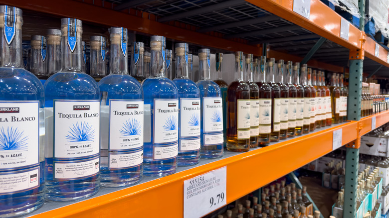 Kirkland tequila bottles sit on a shelf at Costco