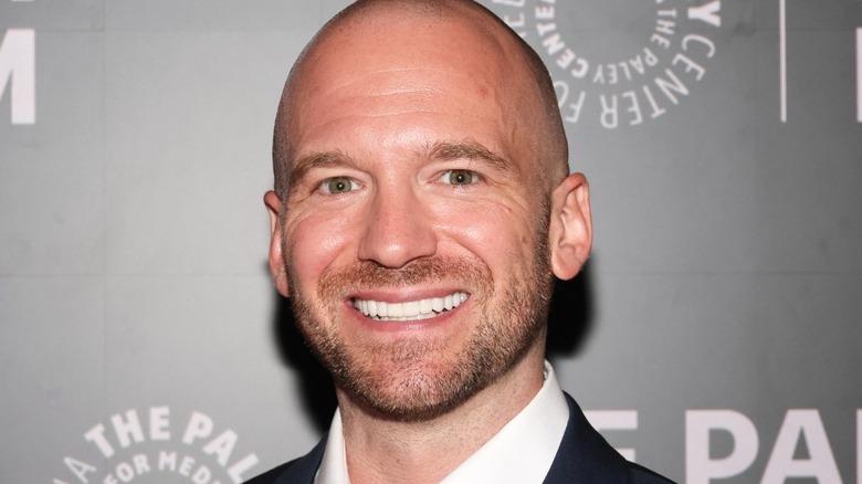 Sean Evans, host of the hit interview series "Hot Ones", at an event.
