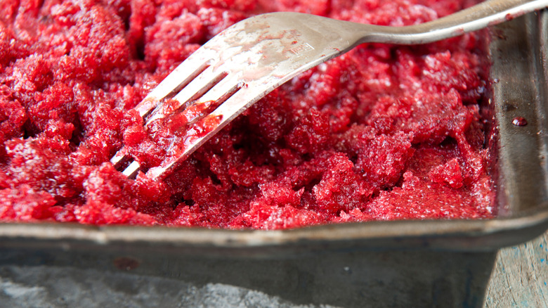 Granita in a pan with a fork in it.