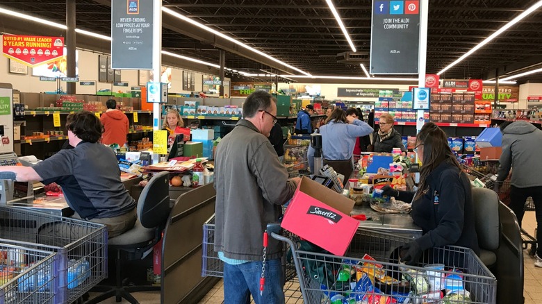 Aldi cashiers ringing up customers