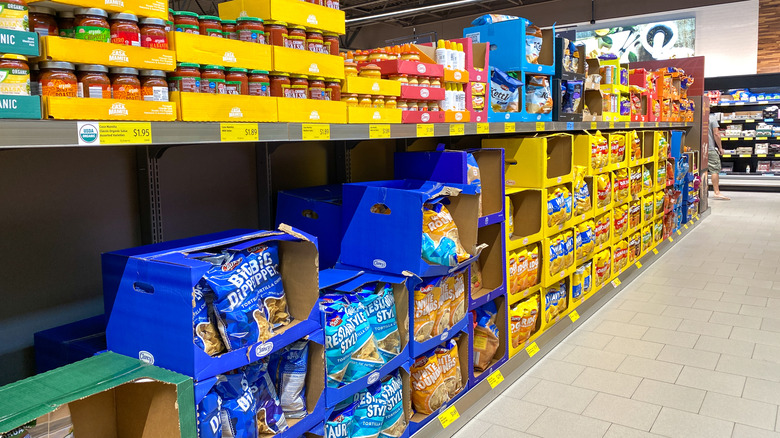 Groceries in boxes in aisle at Aldi