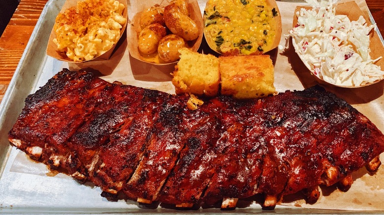 Tray of BBQ ribs and side dishes