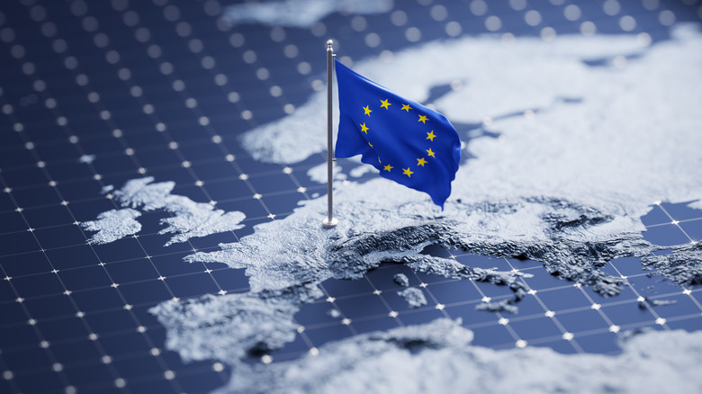 A miniature map of Europe with a European flag on it.