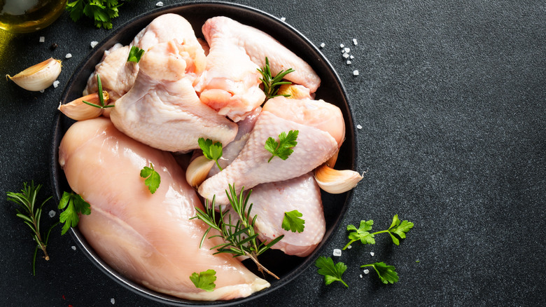 Raw chicken with herbs