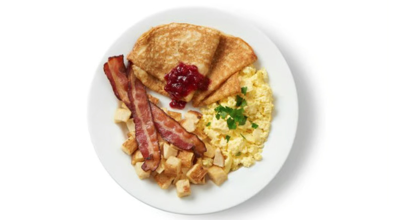 Breakfast plate from Ikea with bacon, potatoes, eggs, and Swedish pancakes
