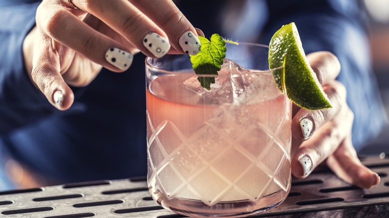 A bartender making a cocktail