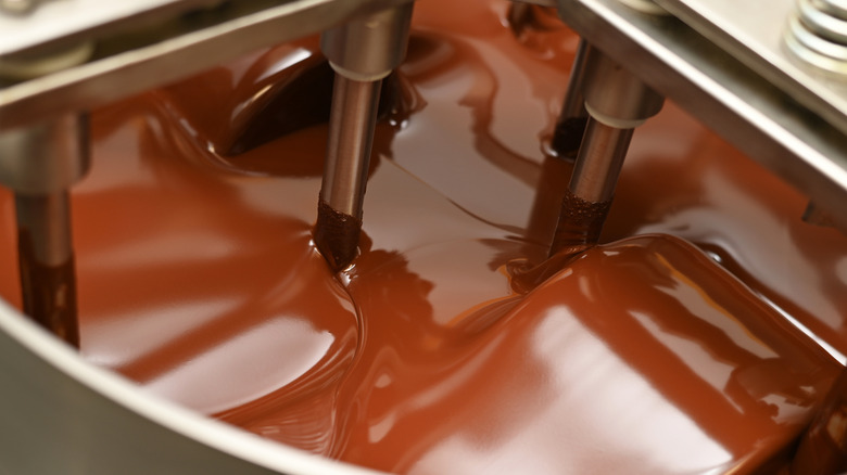 Belgian chocolate is stirred in a conching machine