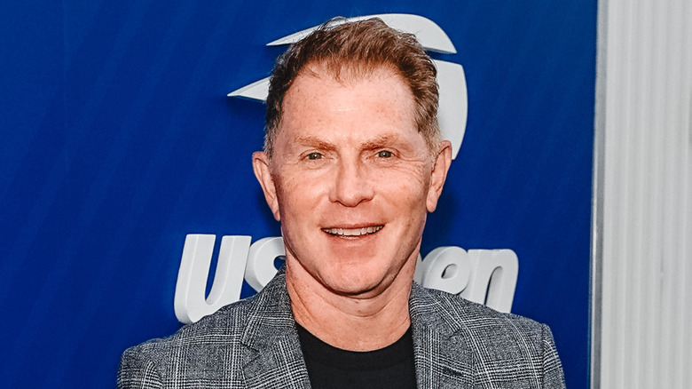 Bobby Flay smiles at US Open